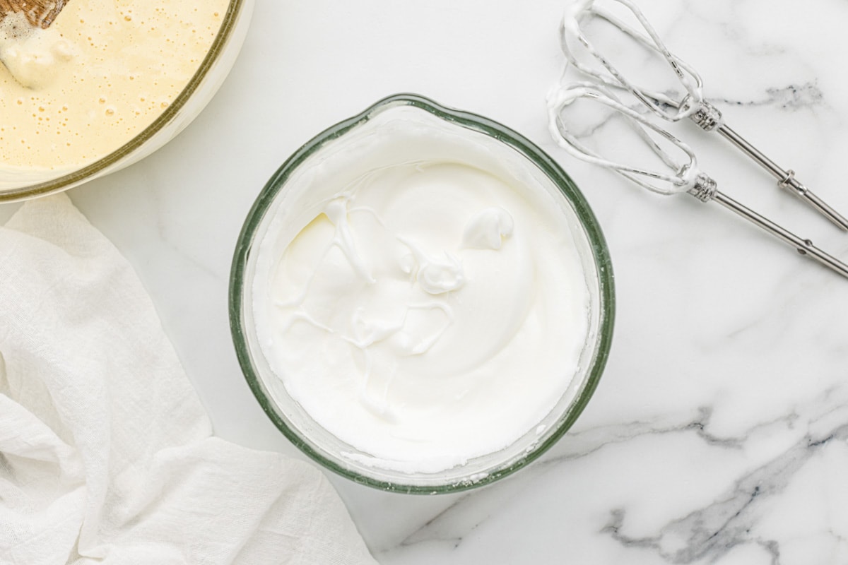 Whipped egg whites in a bowl.