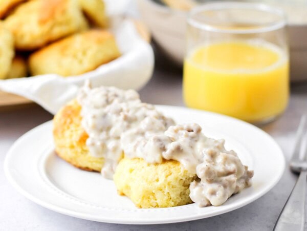 Easy Biscuits and gravy on white plate.