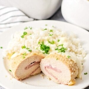Easy chicken cordon blue cut in half on a plate.