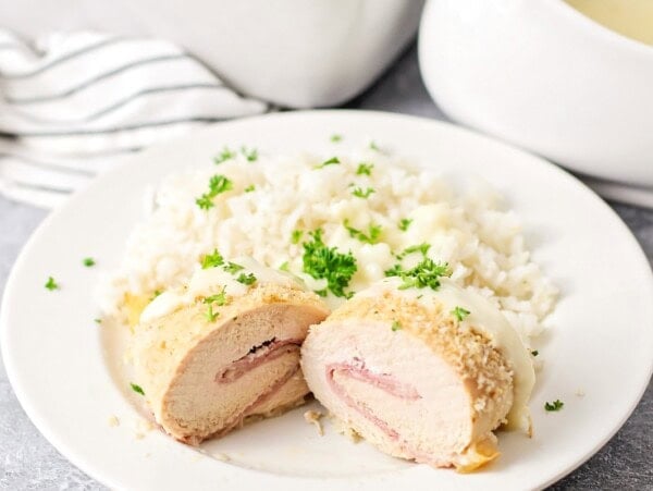 Easy chicken cordon blue cut in half on a plate.