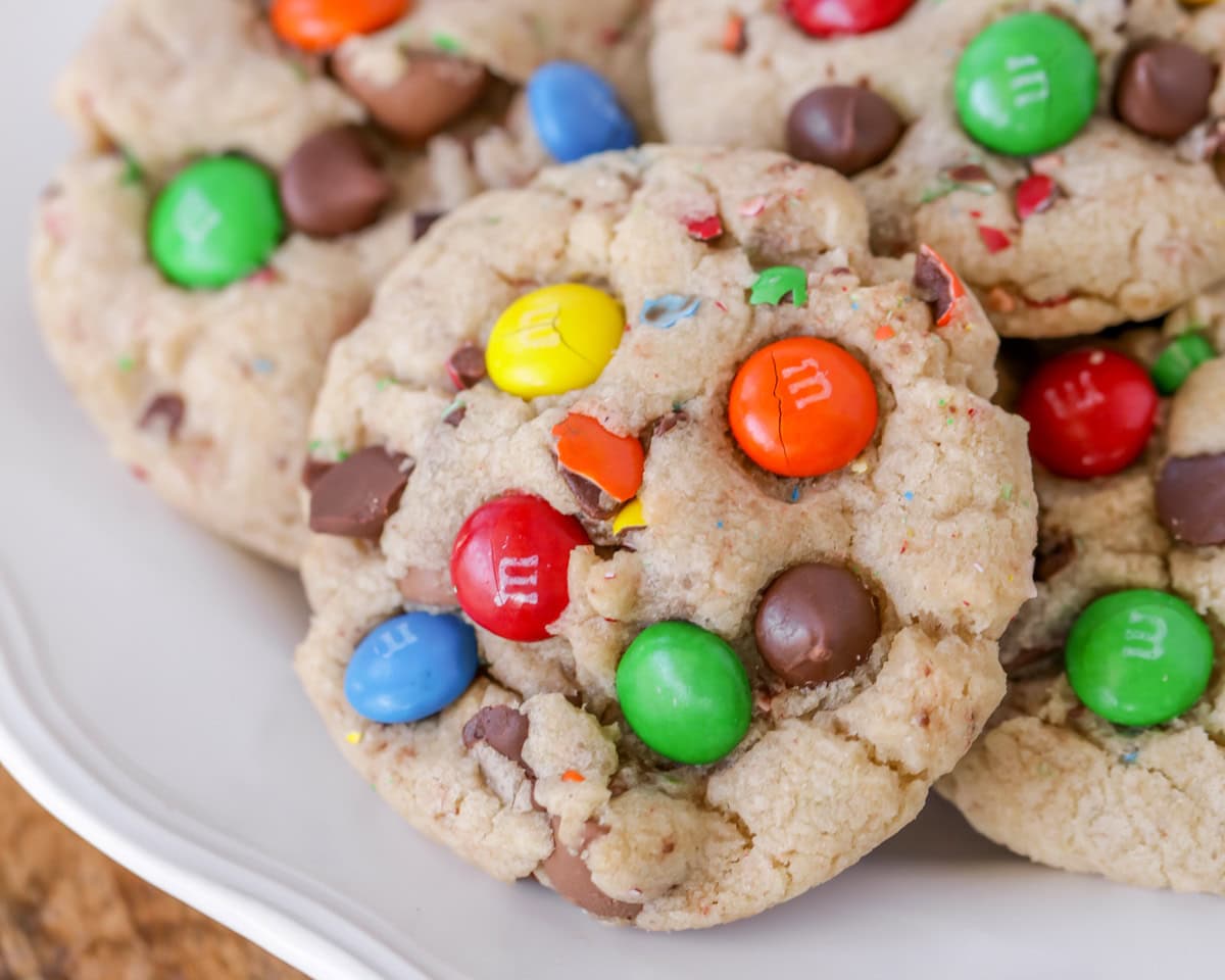 Close up of a plate of chocolate chip M&M cookies.