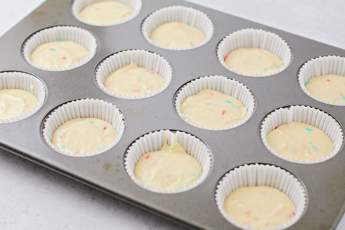 Christmas cupcake batter in lingers in muffin tin.