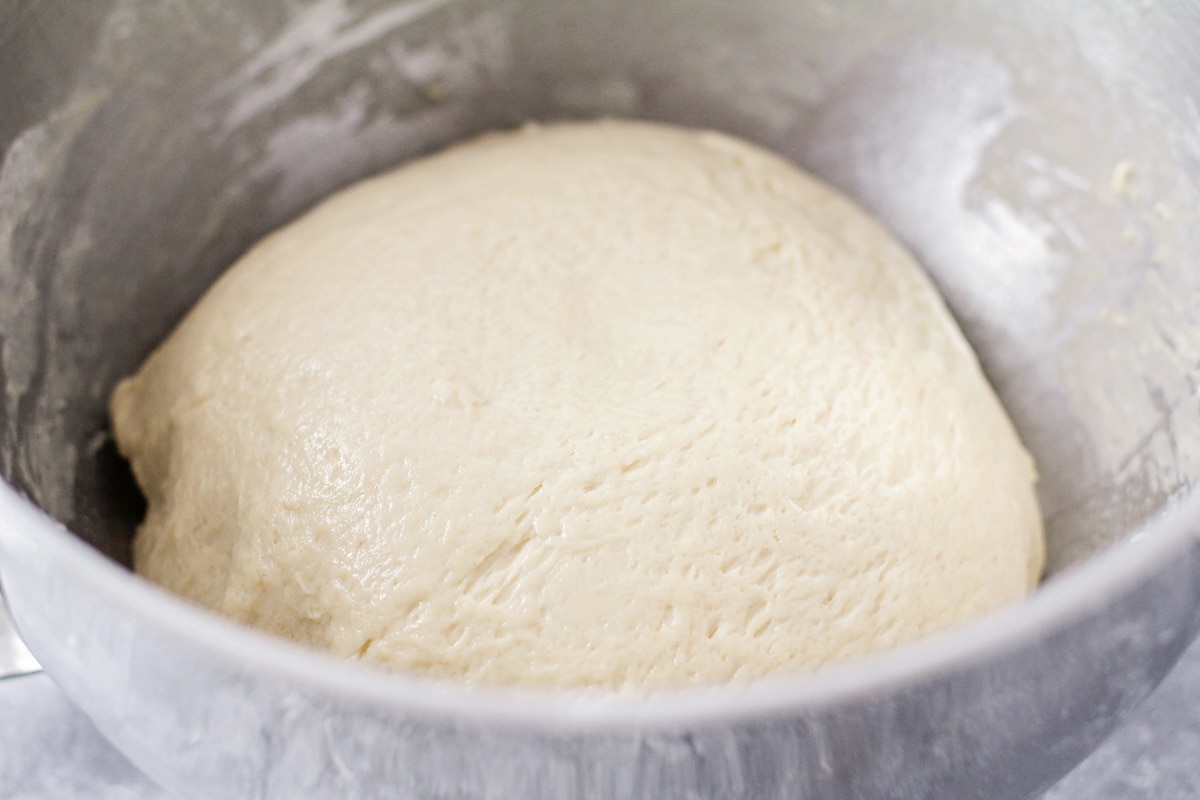Process for making white bread dough shaping in a bowl.