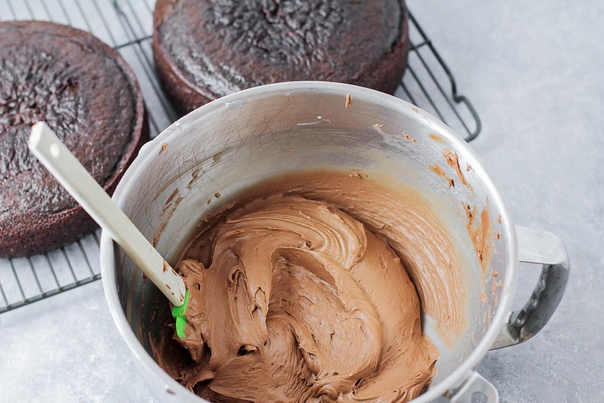 Chocolate buttercream frosting in bowl.