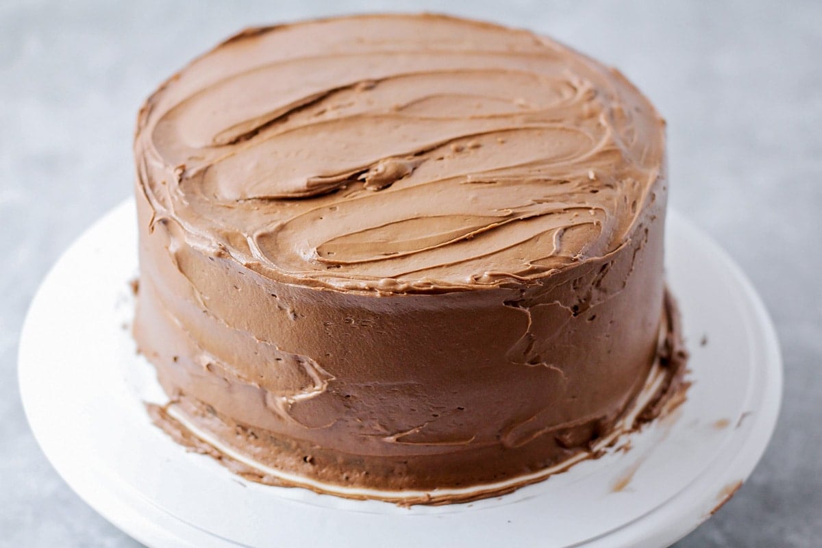 Chocolate Buttercream Frosting spread over cake.