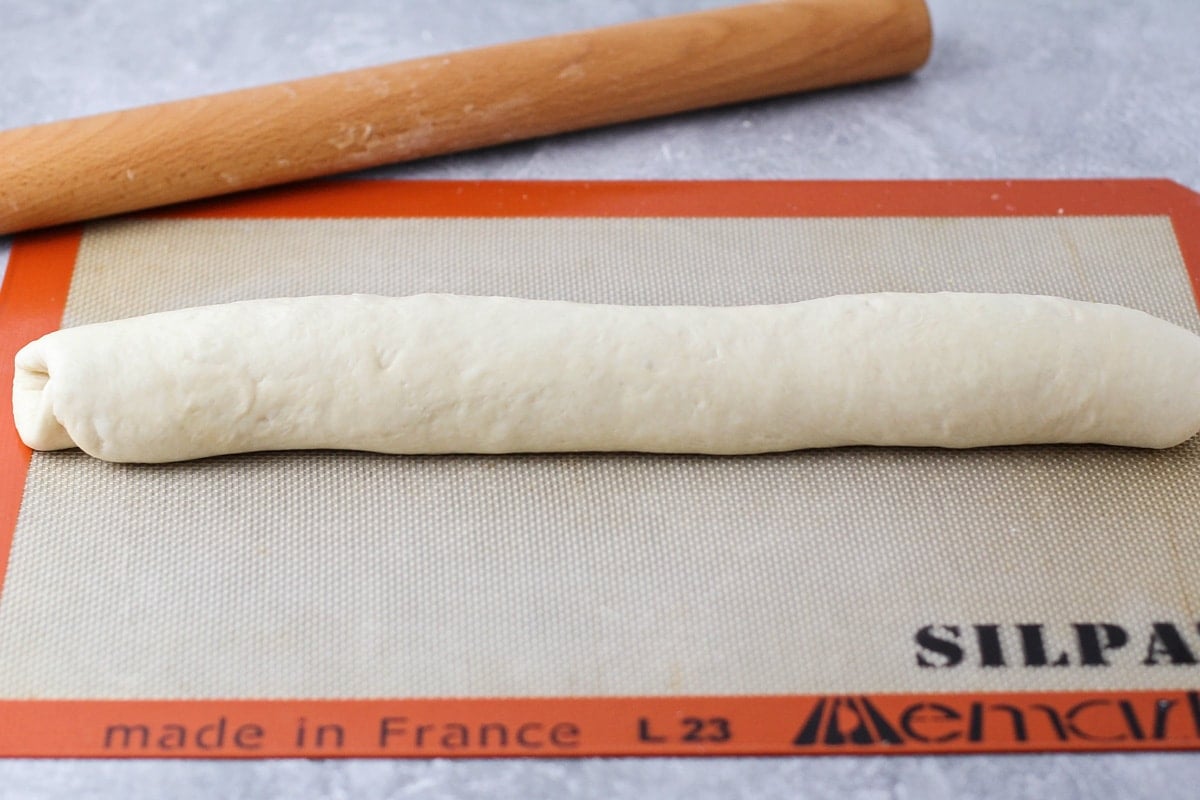 French bread dough rolled on a slipmat.