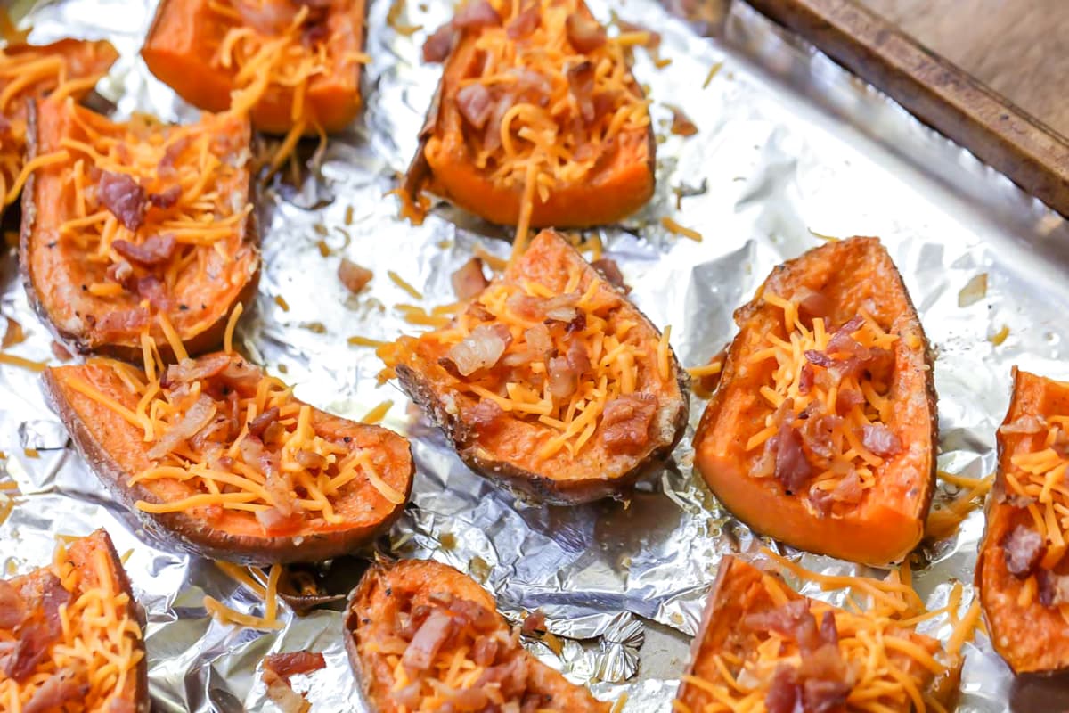 Ingredients for sweet potato skins on foil lined baking sheet.