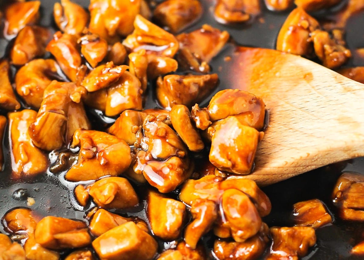 Sauce covered teriyaki chicken in a skillet.