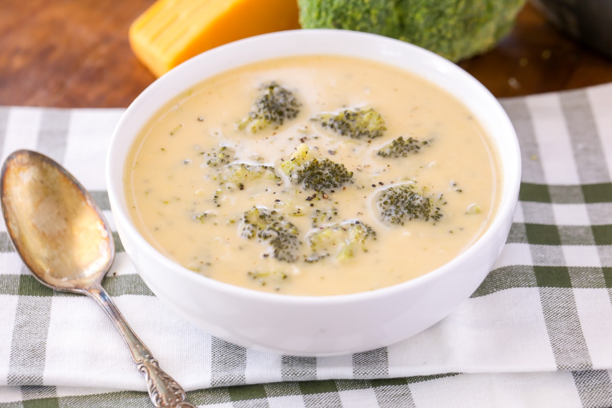 Easy Broccoli cheese soup in white bowl.