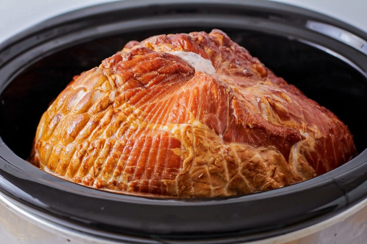 Crockpot brown sugar ham in a slow cooker, ready to heat.