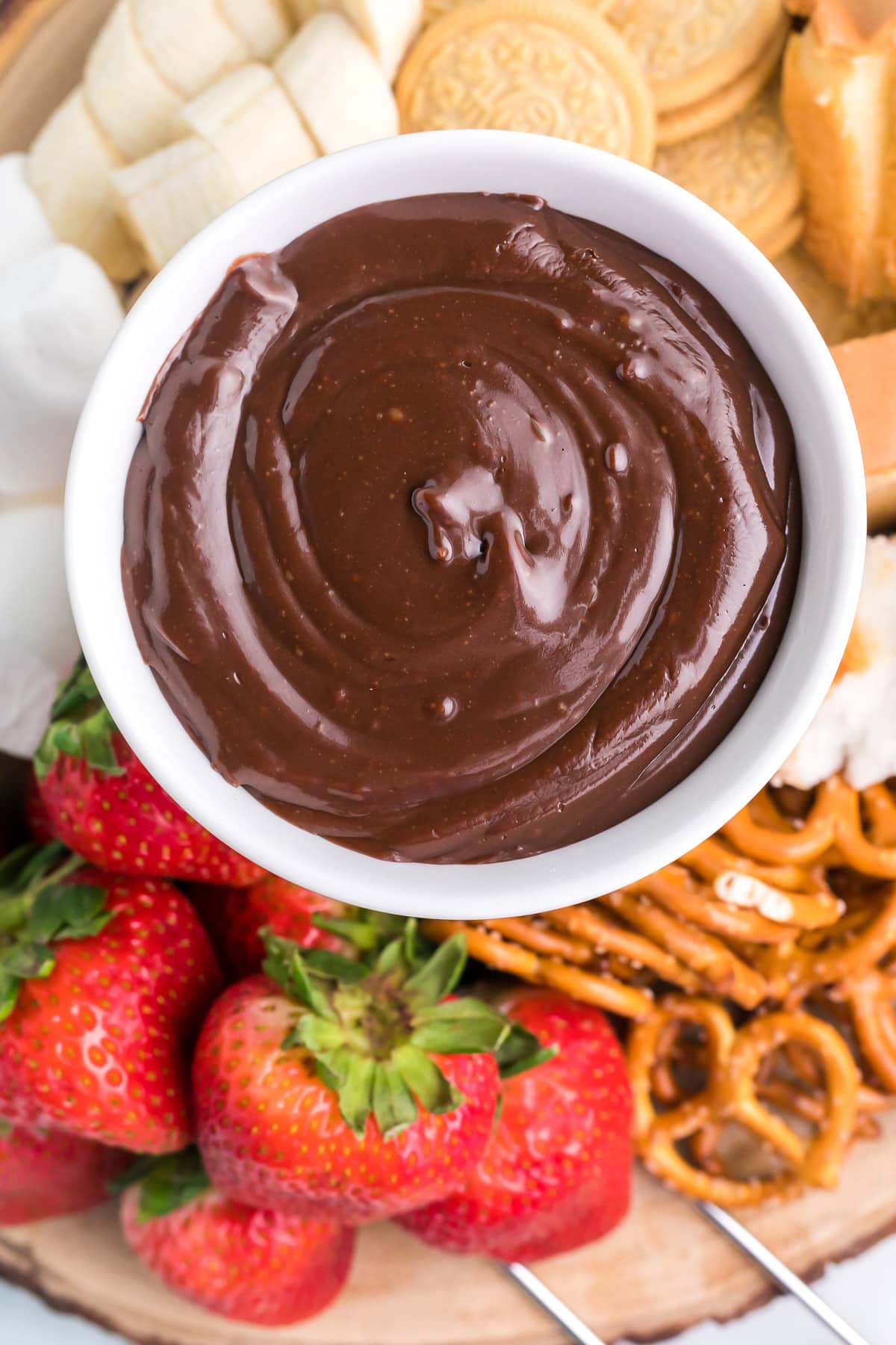 Chocolate fondue in a white bowl.