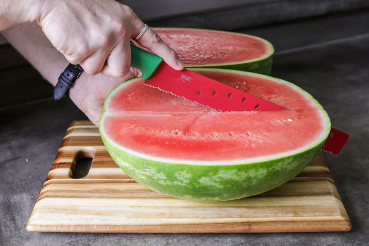 Cutting a watermelon into quarters
