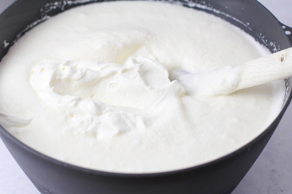 Fluffy white mixture for eggnog recipe.