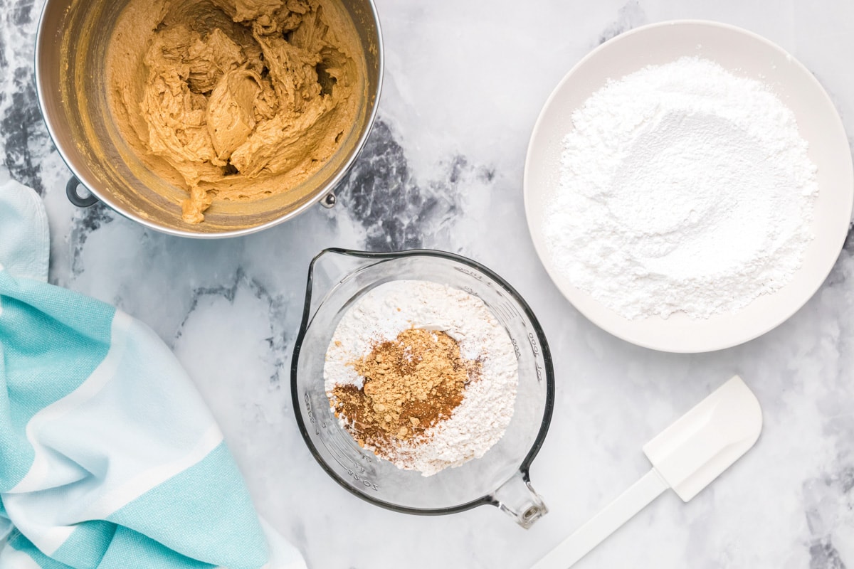 Combining dry ingredients for molasses crinkle cookies.