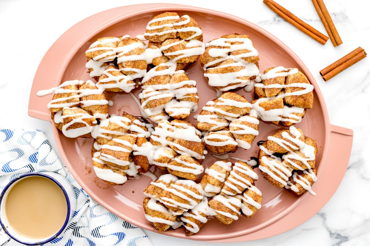 Monkey bread muffins drizzled with glaze.