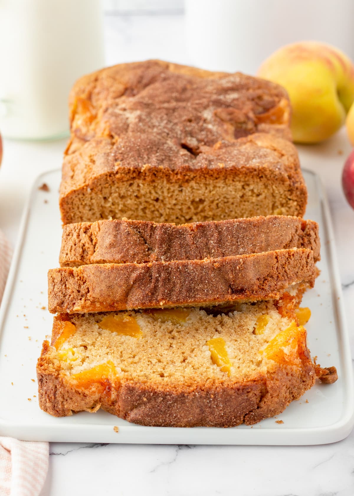 Close up of sliced peach bread on a plate.