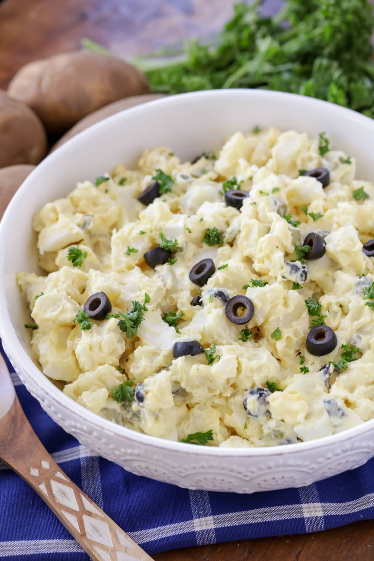 Finished close up of a bowl of homemade potato salad.