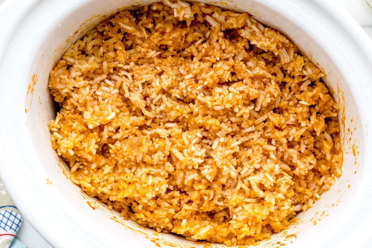 Fluffed crockpot spanish rice in a slow cooker.