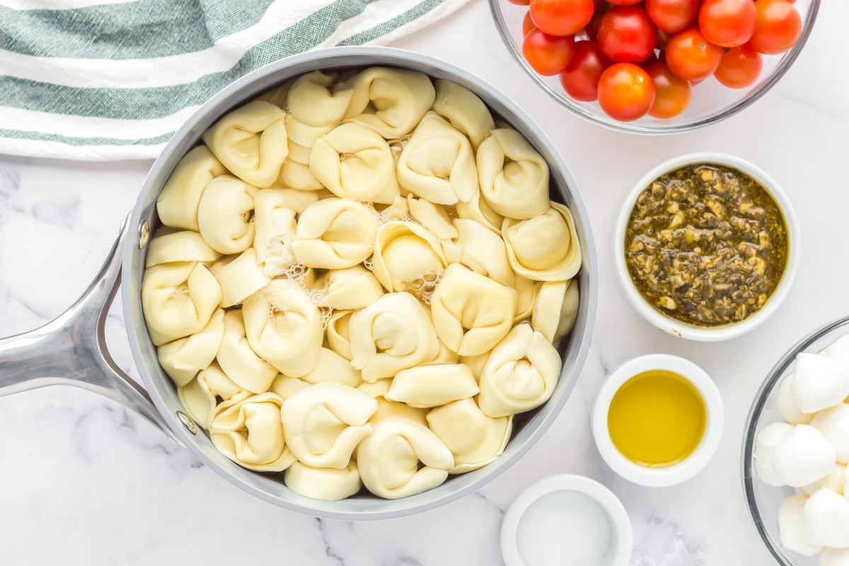 Pasta cooking in a pot for tortellini skewers.