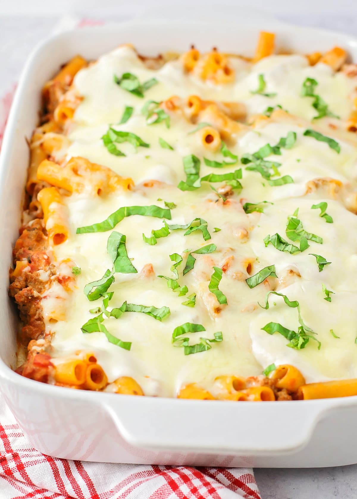 Easy baked ziti topped with fresh basil.
