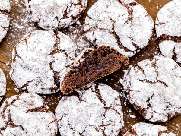 Homemade Chocolate Crinkle Cookies on wood board.