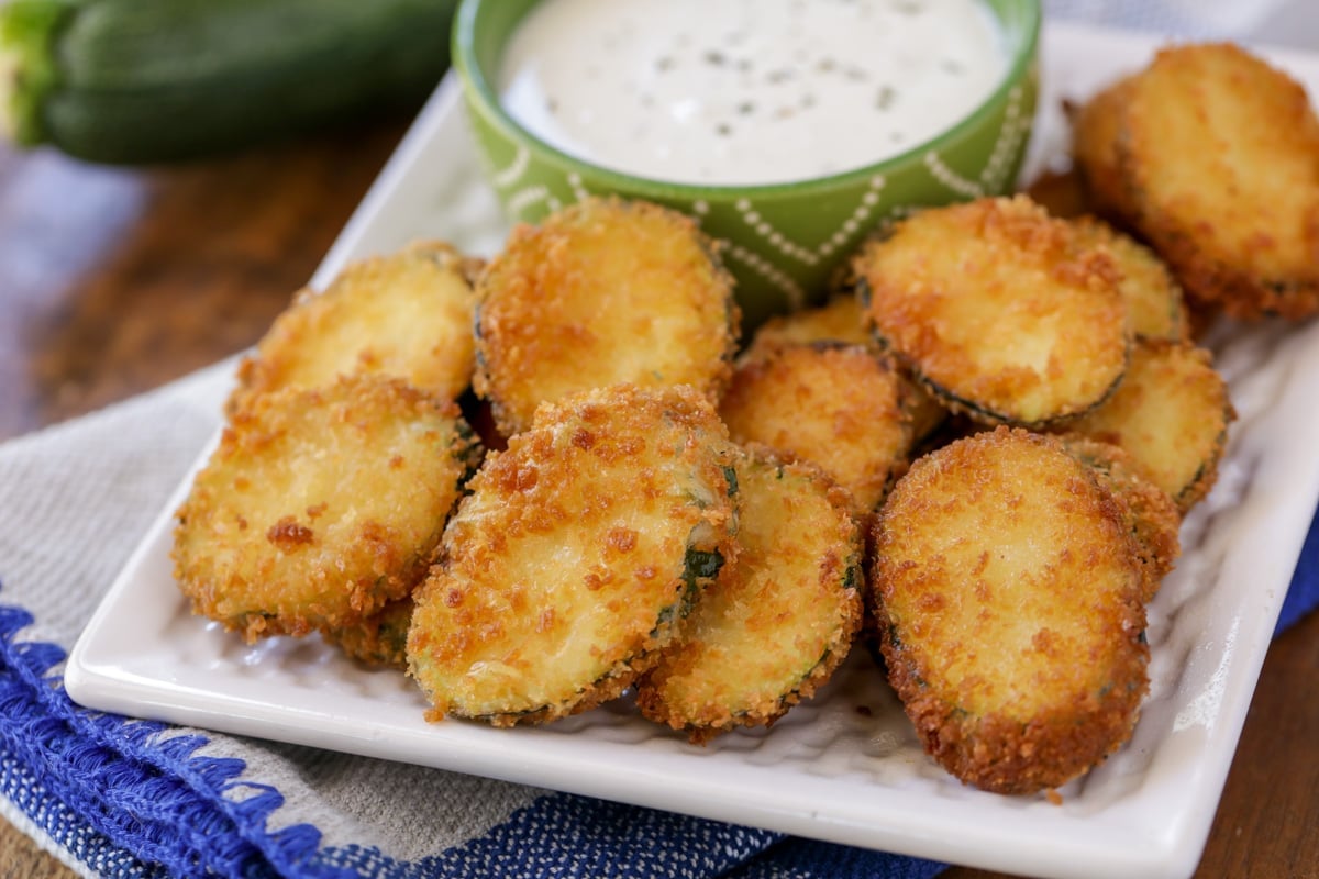 Valentines Dinner Ideas - fried zucchini with a side of ranch dressing on a white plate. 