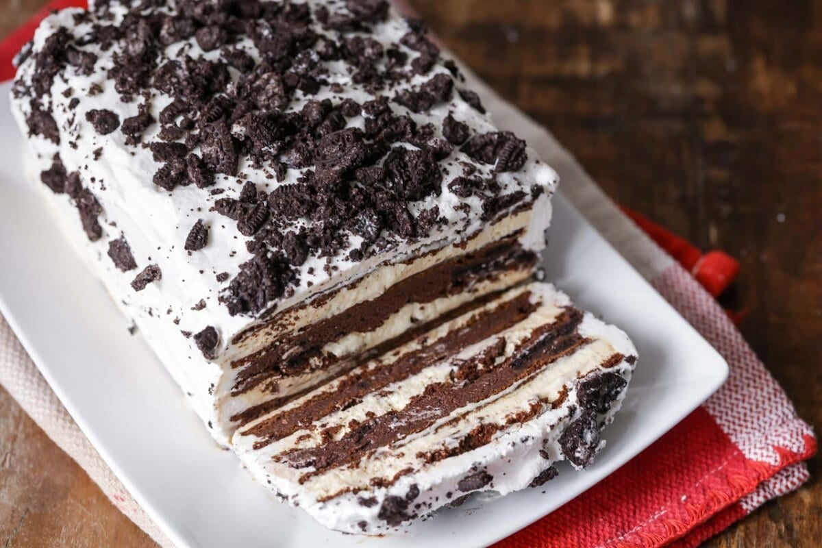 Ice Cream Sandwich cake sliced on white platter.
