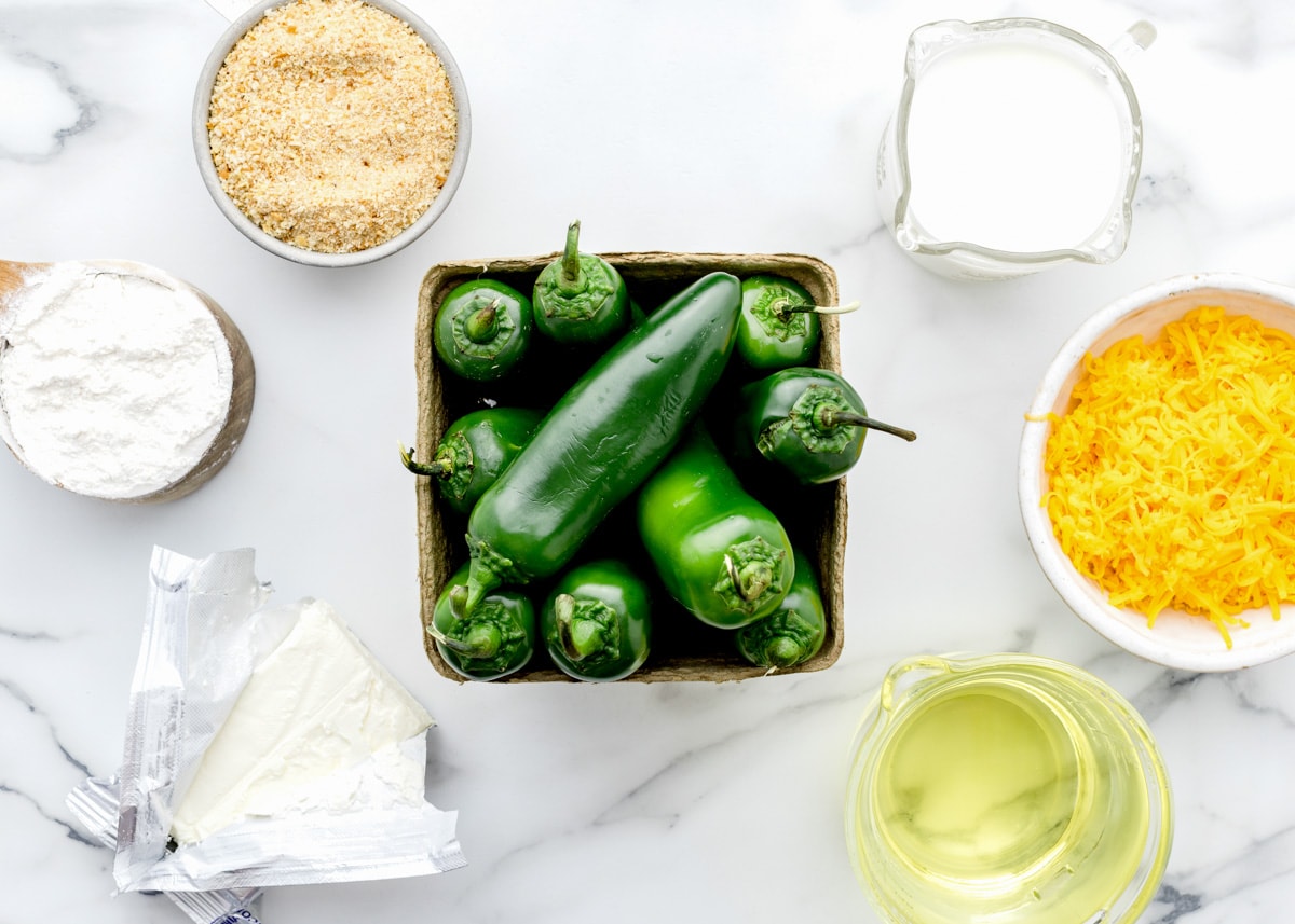 Ingredients to make jalapeno poppers on the counter.