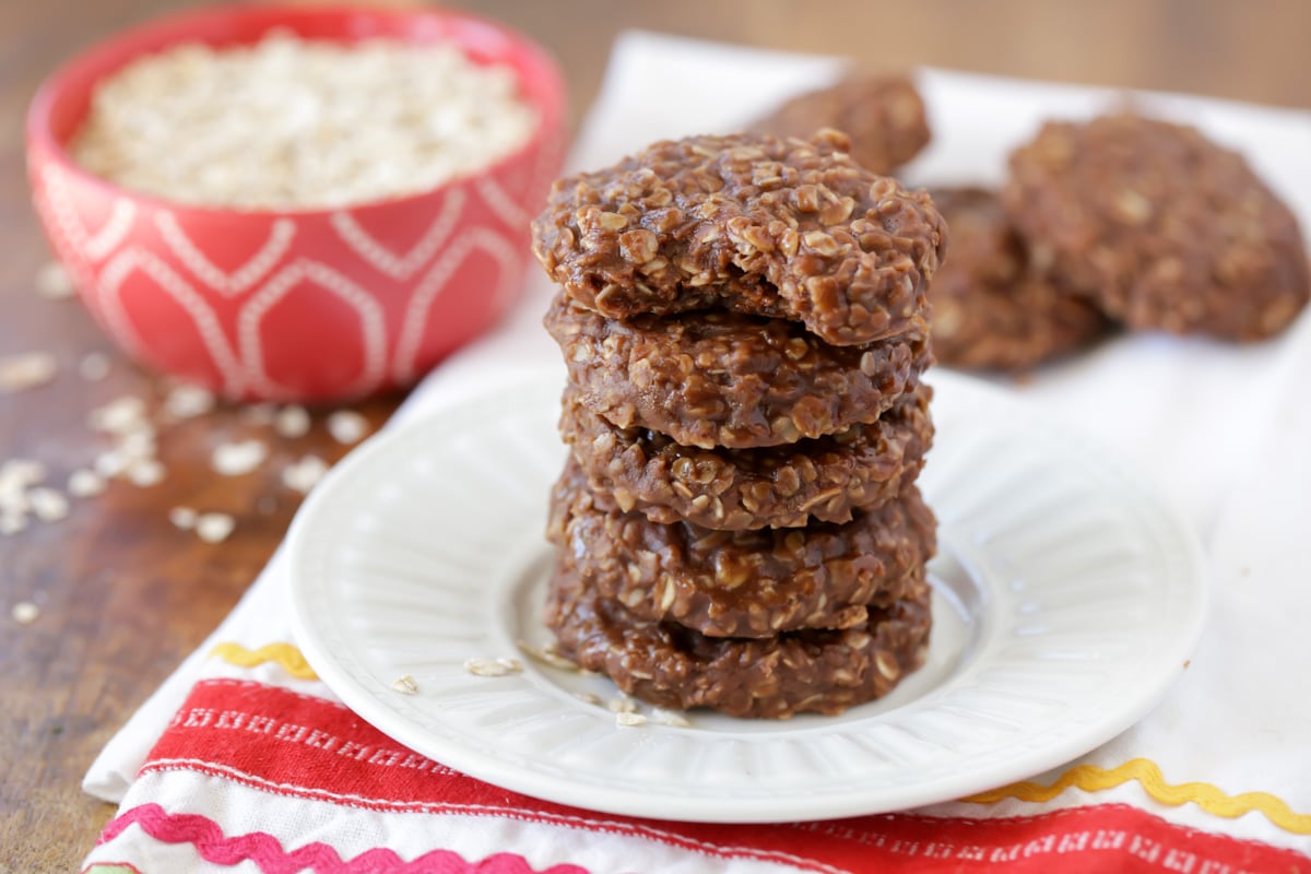 No Bake Cookies stacked on white plate.