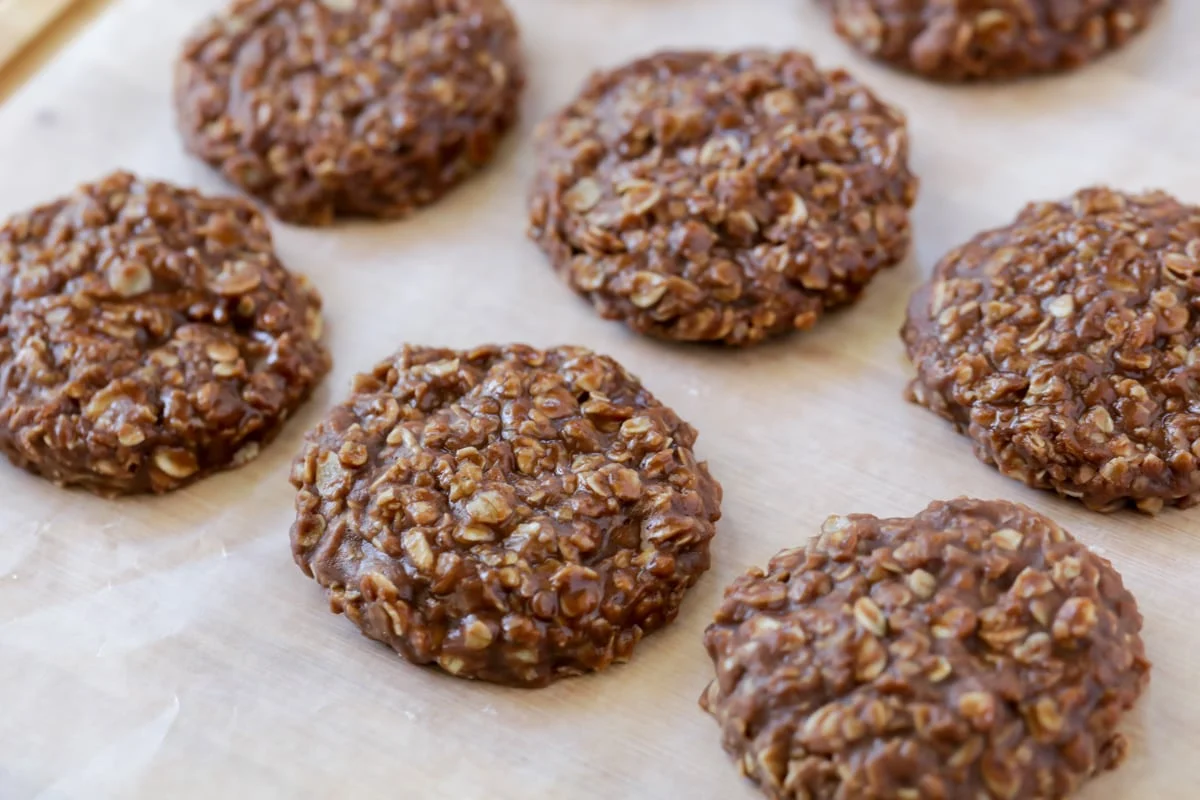 No Bake cookies setting up on wax paper.