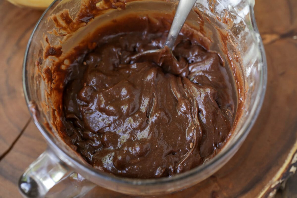 Brownie batter mixed in a glass bowl.