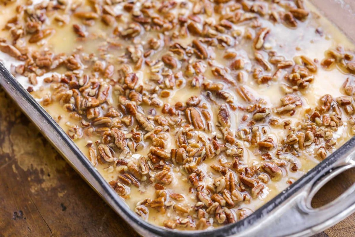 Pecan mixture on layers of cake mix and pumpkin filling.