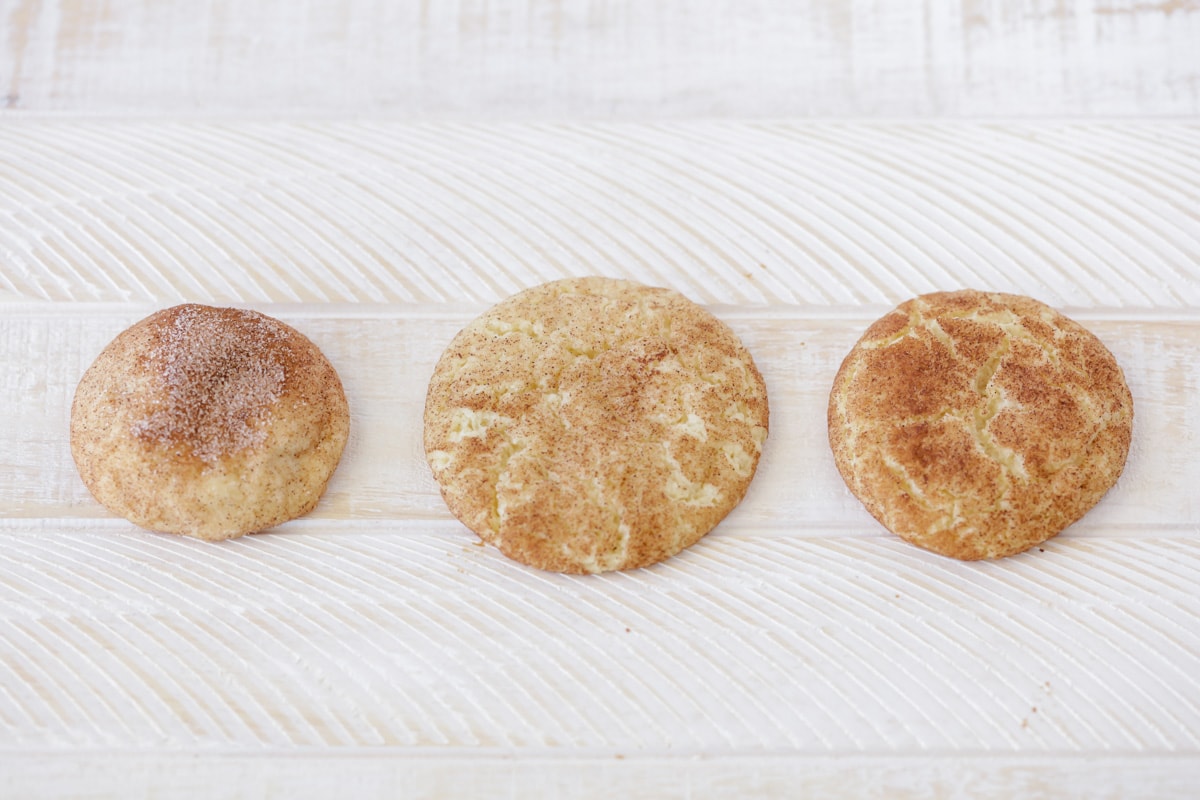 Three different snickerdoodle cookies cooked using different methods.