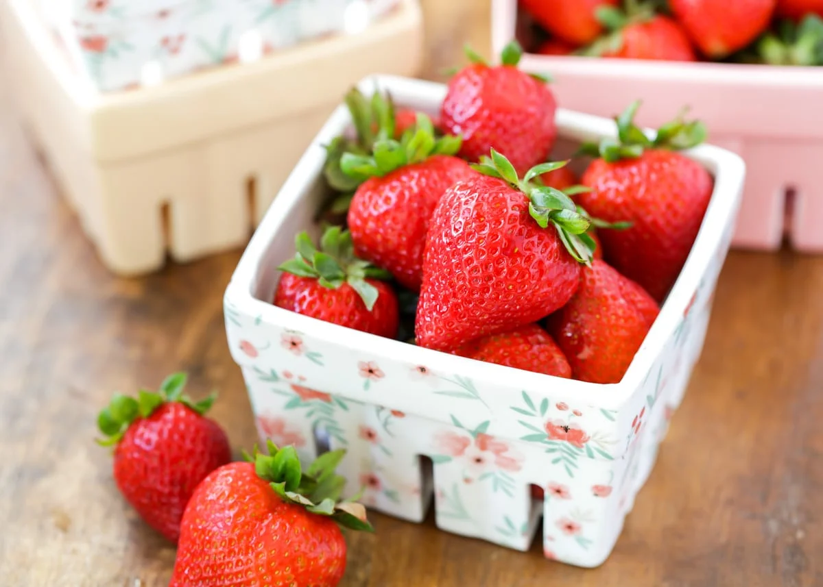 Strawberries in glass caton.