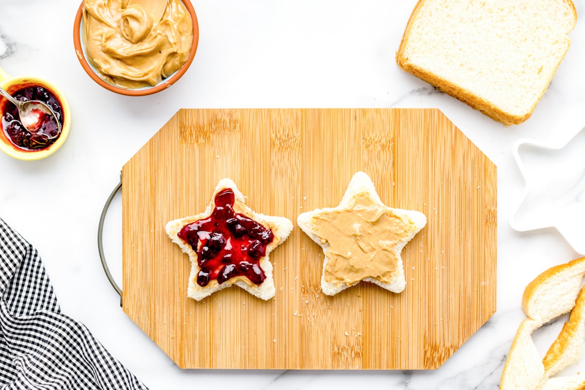 Making star shaped pbj sandwiches for the after school snack board.