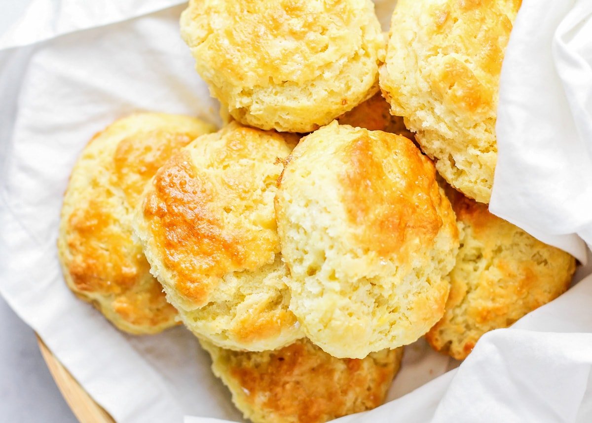 Buttermilk biscuits recipe wrapped in a white towel.