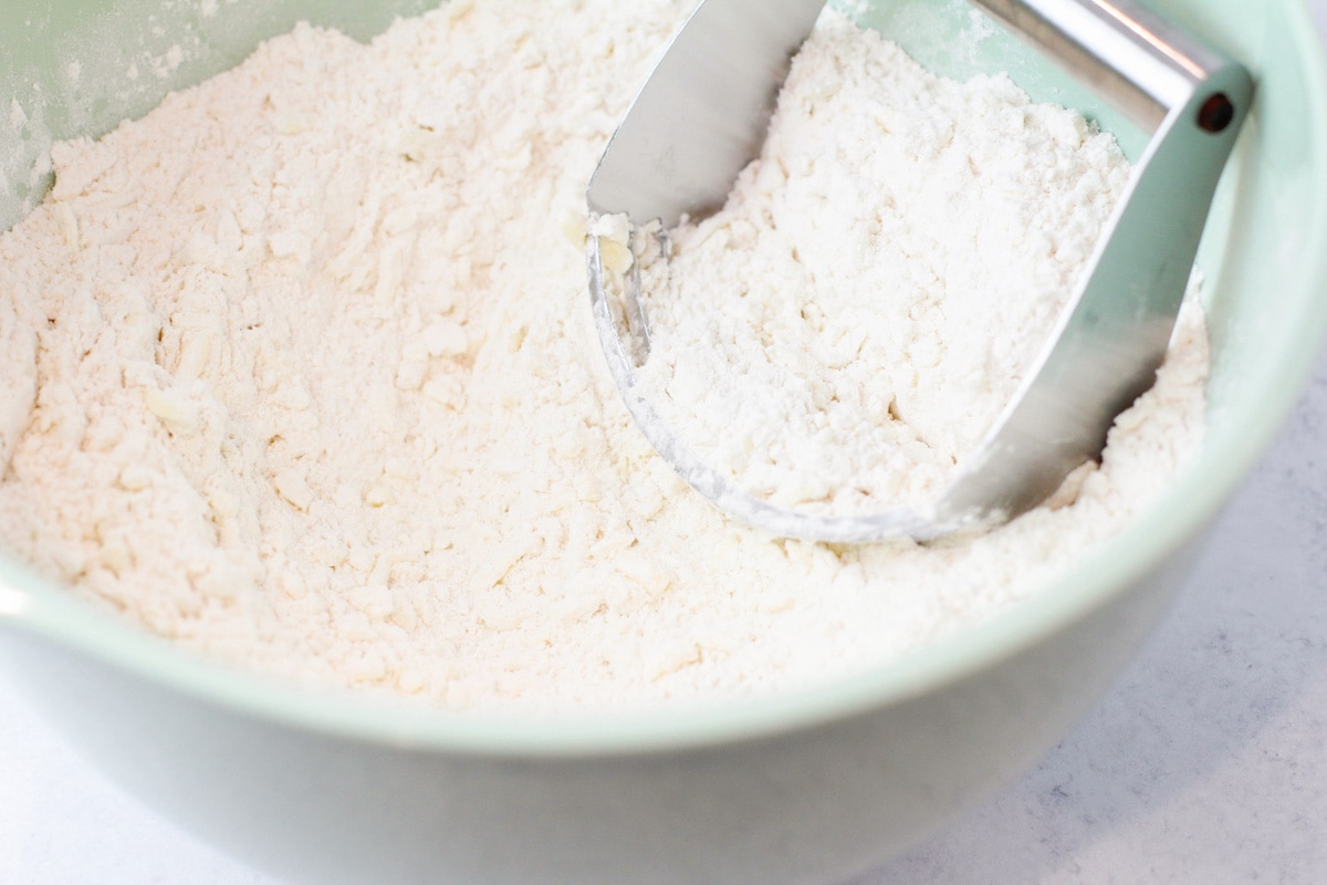 Cutting butter into flour for easy biscuits.