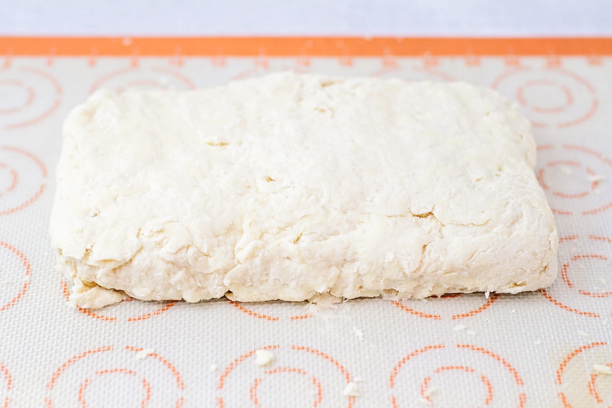 Prepping to cut easy biscuit dough.
