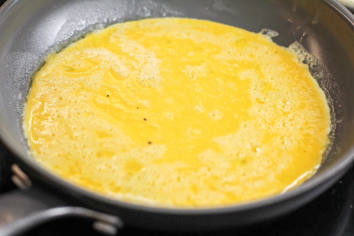 Cooking an omelette in a skillet.