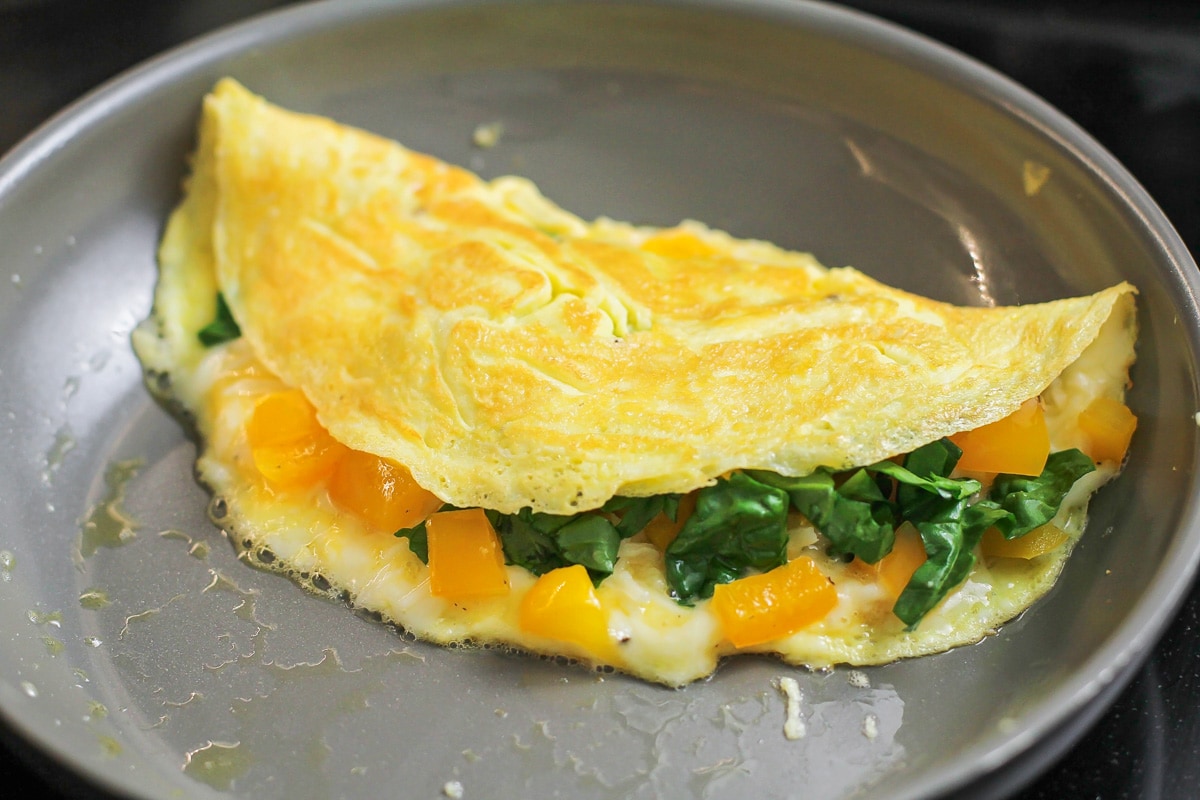 Cooking an omelette folded in half.