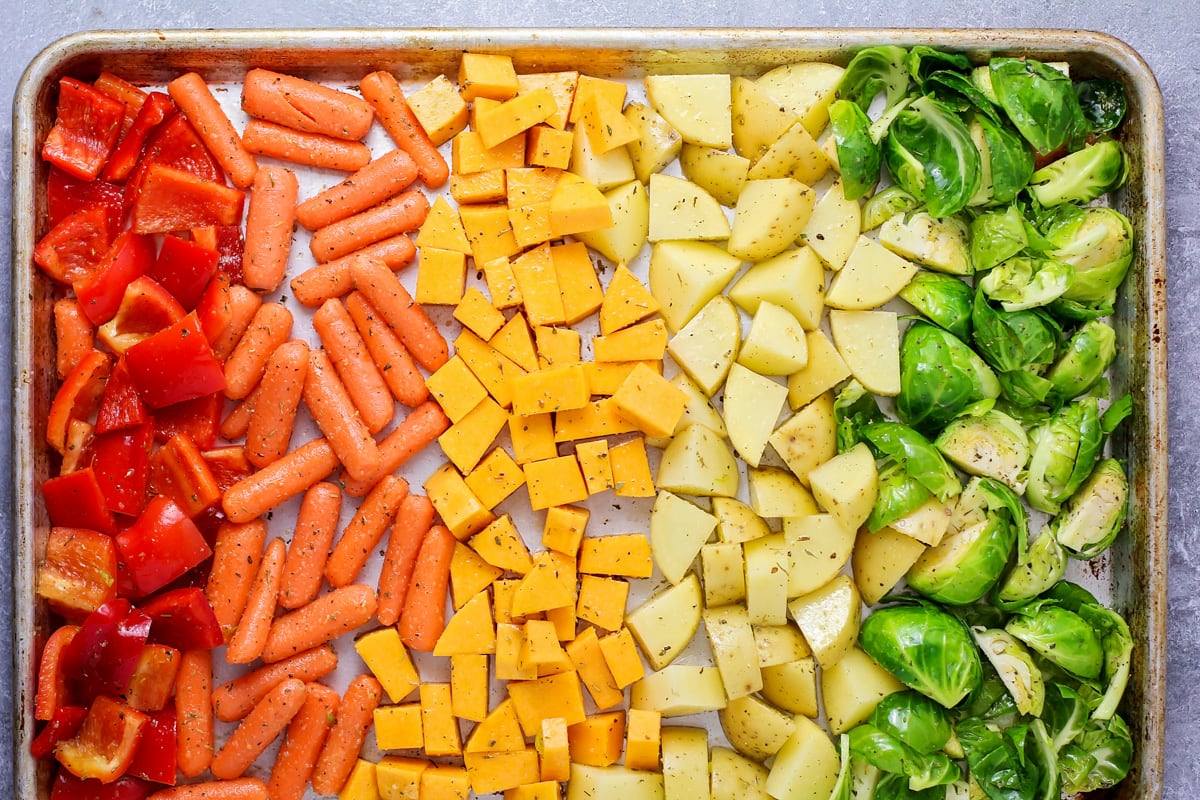 Oven roasted vegetables on on baking dish.