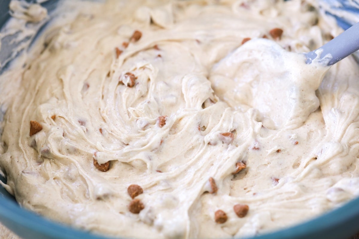 Close up of mixing the cinnamon chips into the snickerdoodle bread batter.