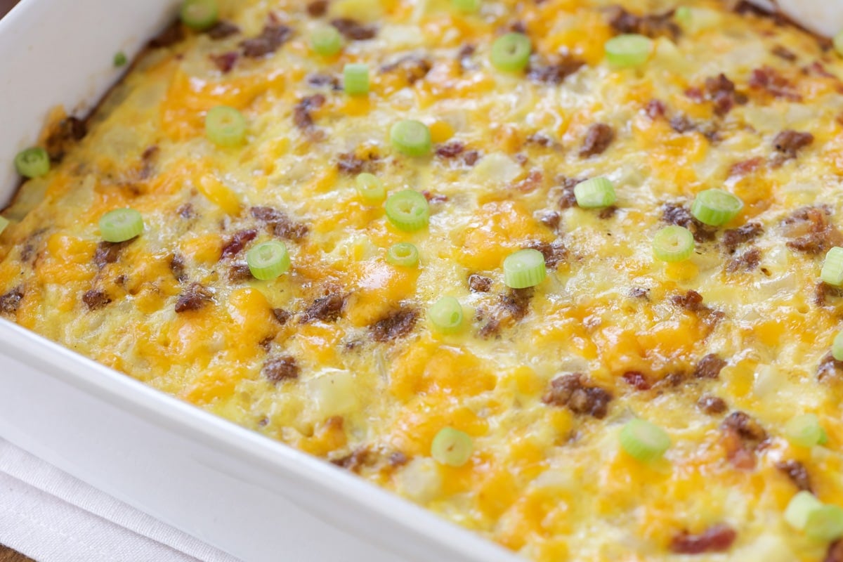 Fresh baked cheesy breakfast potato casserole topped with green onions.
