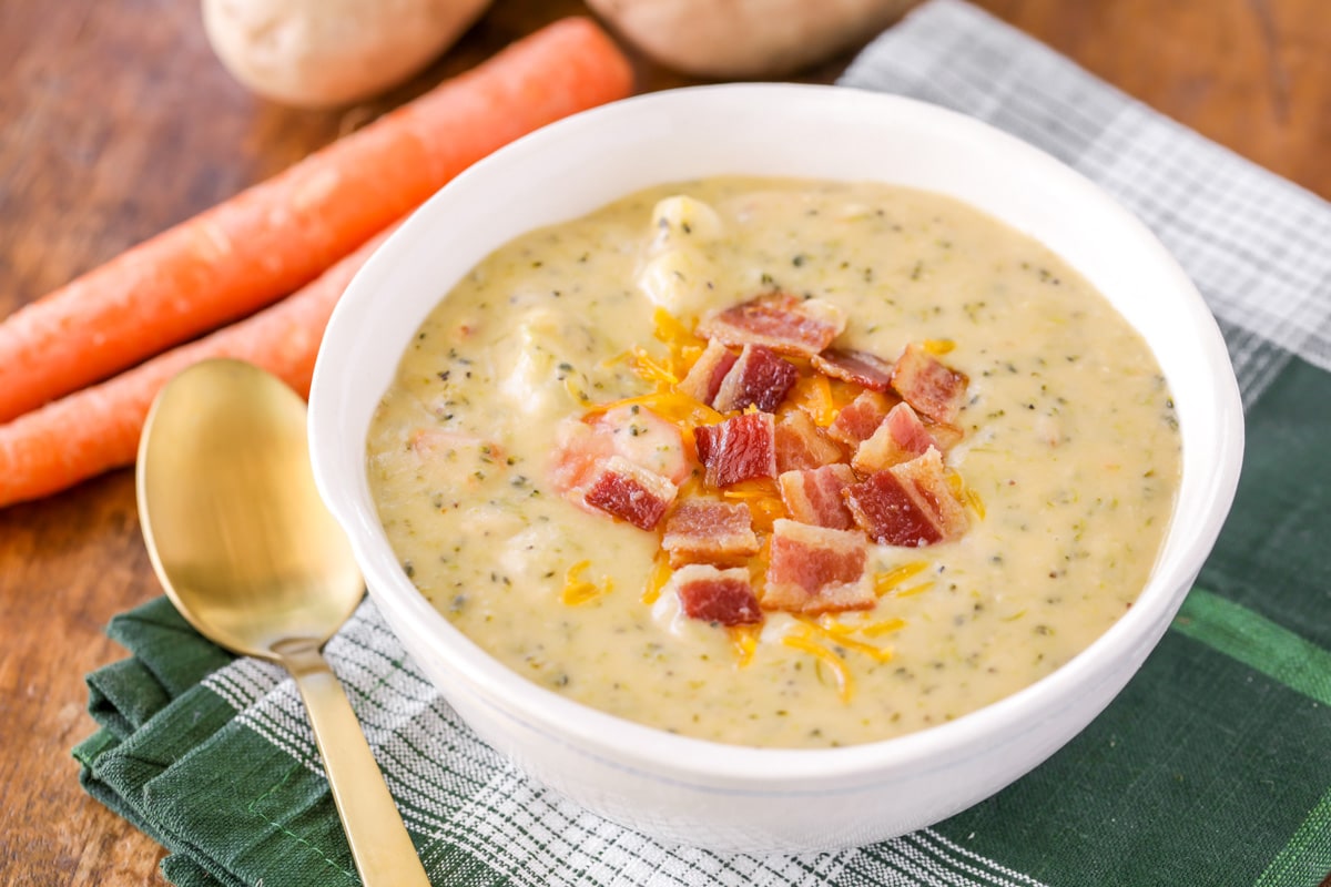 Bacon on top of loaded Broccoli Potato Soup in white bowl topped with bacon.