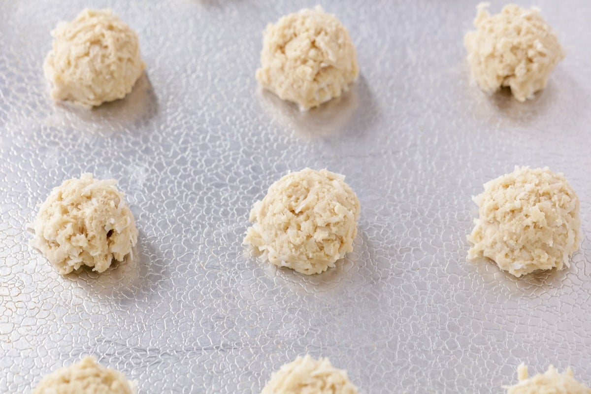 How to make coconut cookie process pic - dough scooped out onto cookie sheet.