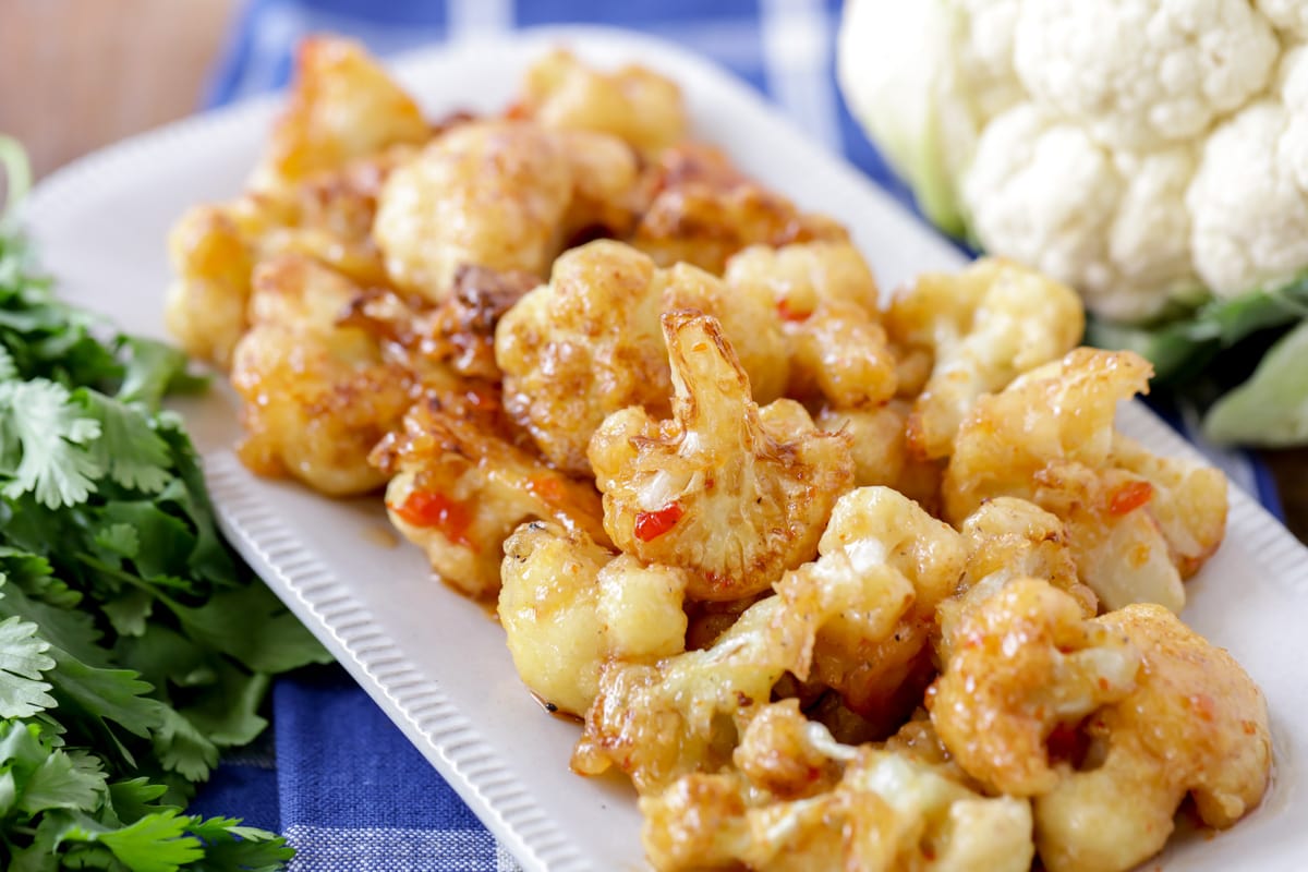 Asian Dinner Recipes - Fried Cauliflower on a white platter. 