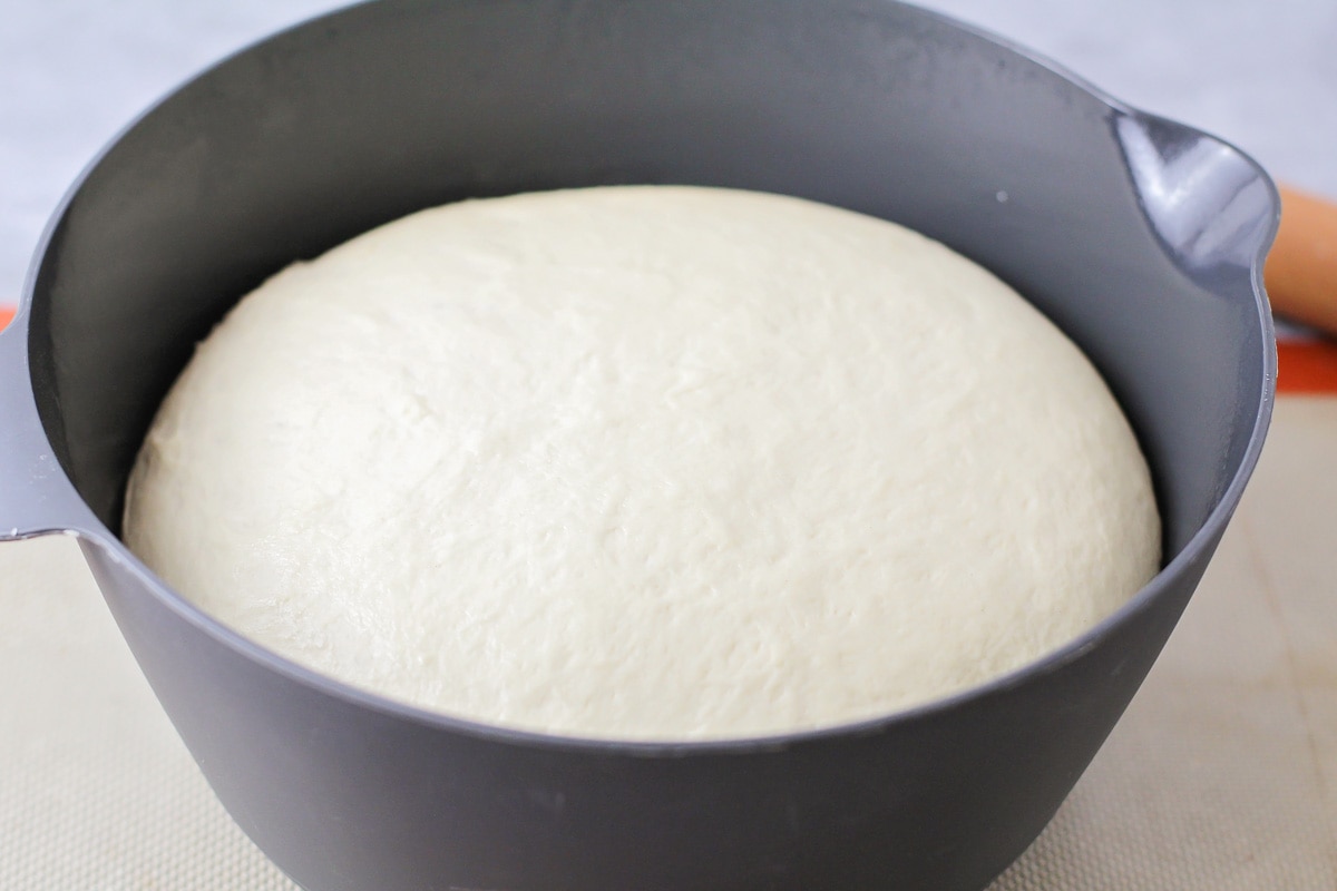 Bread dough risen in a bowl.