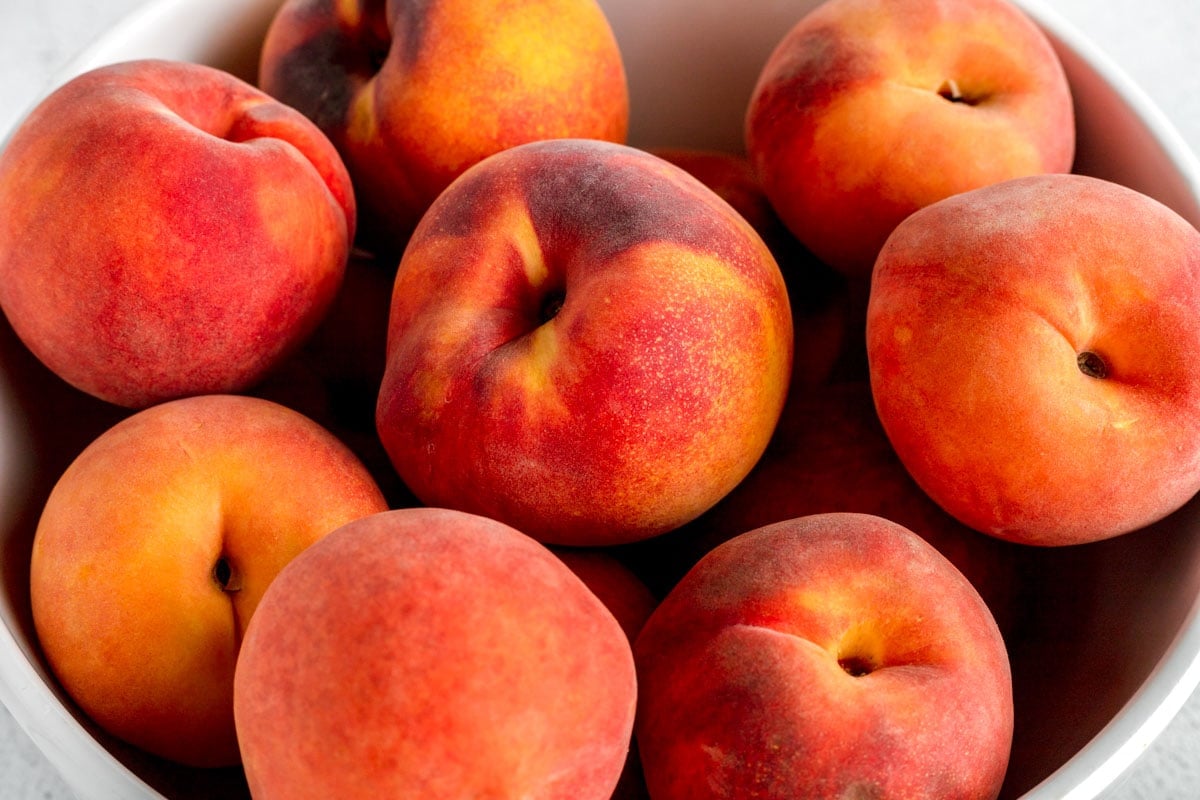 Peaches for peach crisp in bowl.