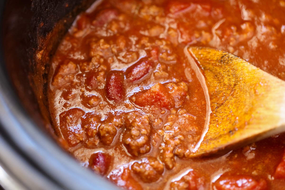 Slow cooker chili cooking in a crockpot.