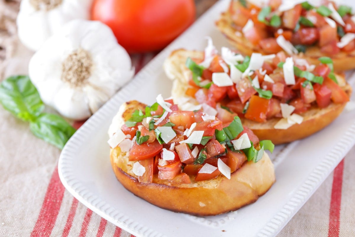 Bruschetta recipe served on a white platter.